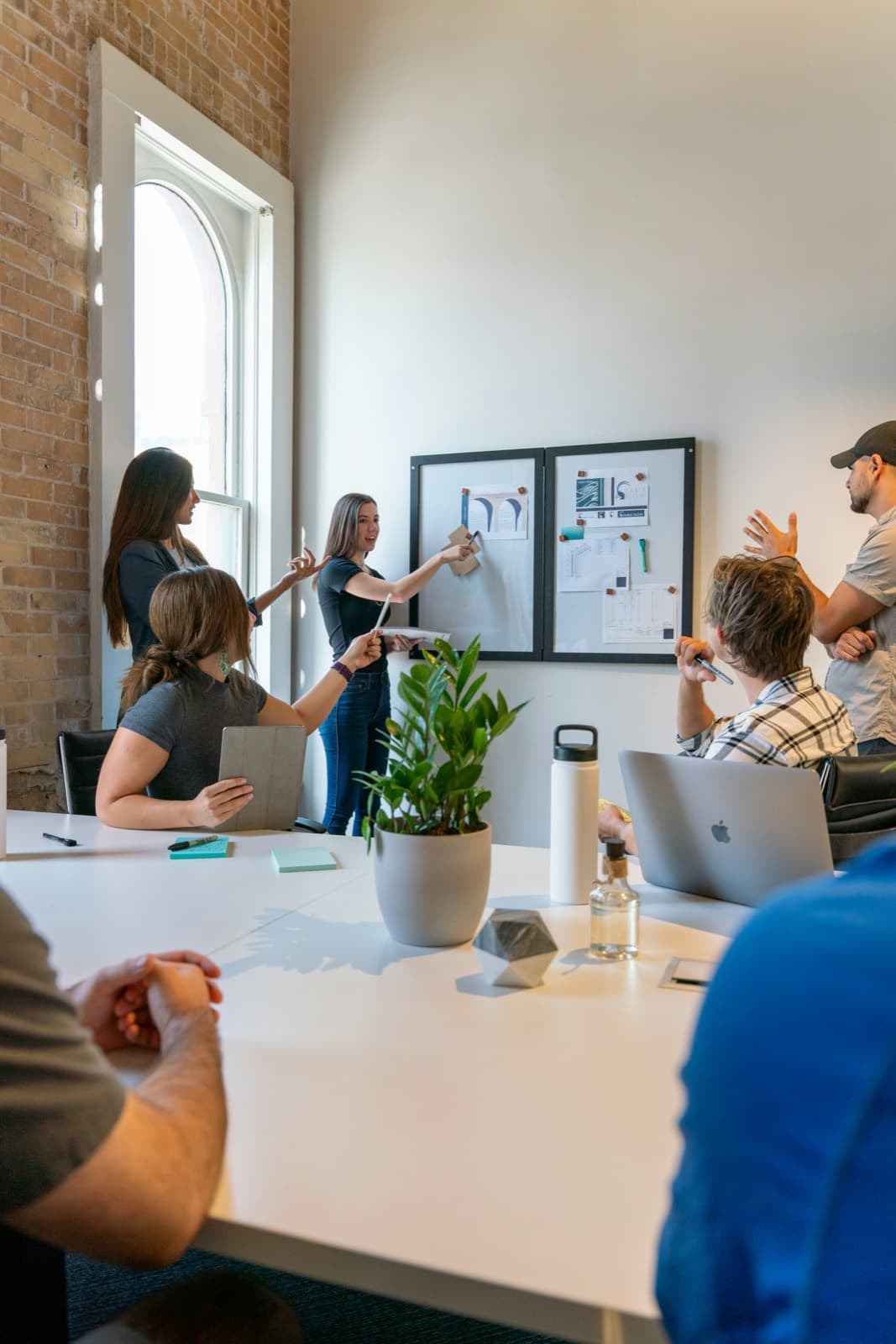 A room of people working through a plan